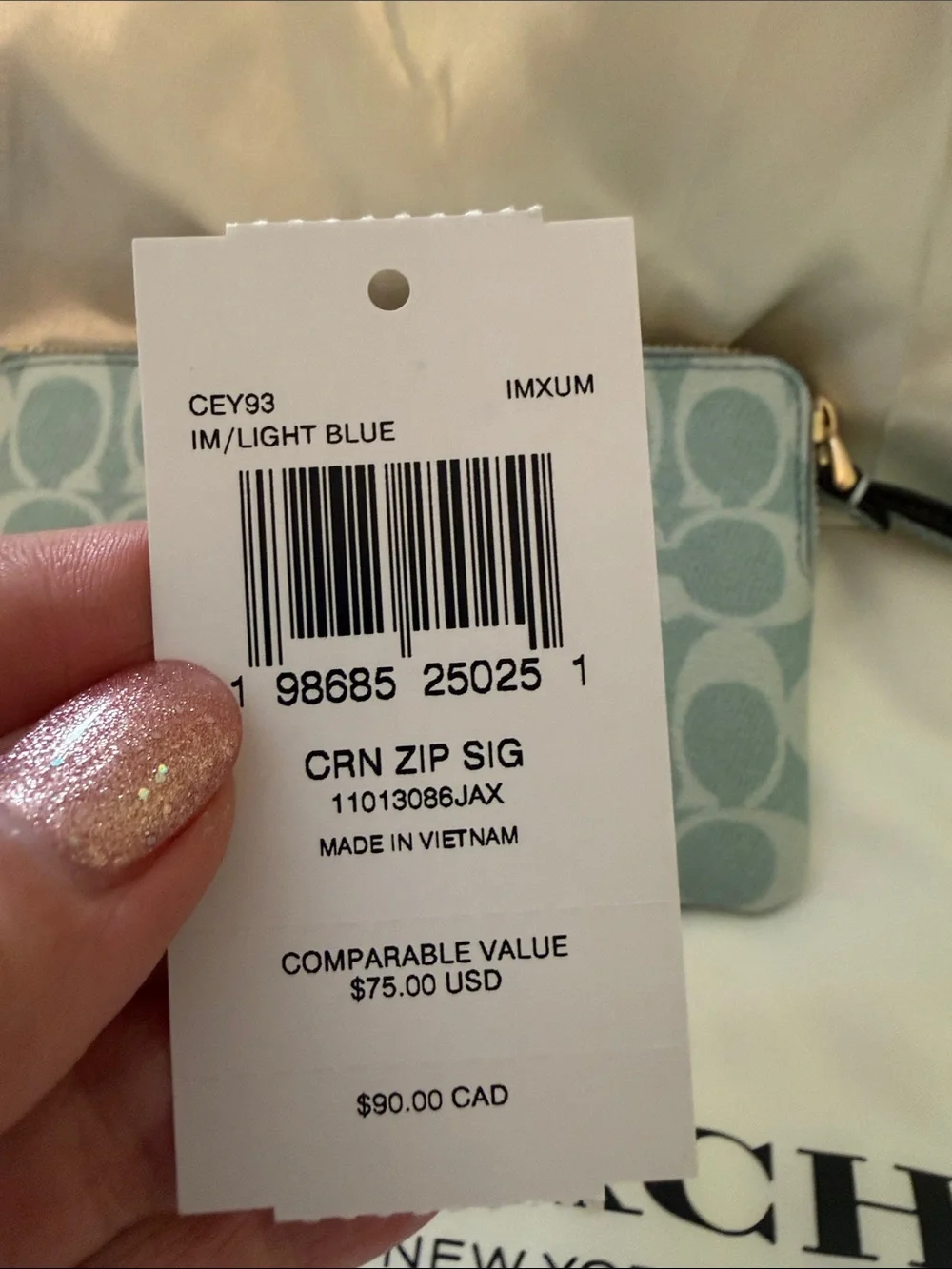 Coach wristlet featuring